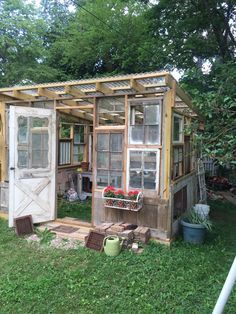 an old outhouse is being converted into a garden shed