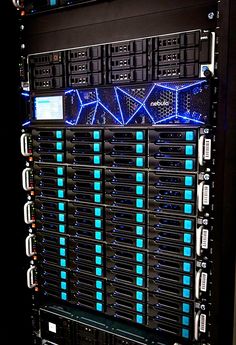 the back side of a server with blue lights on it's sides and black racks