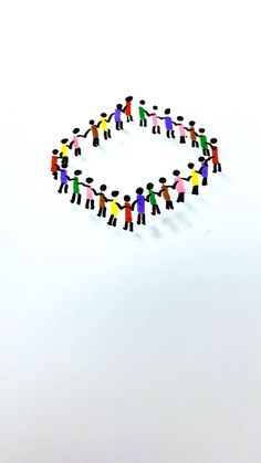 a group of people holding hands in the shape of a circle on a white background