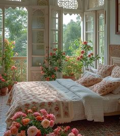 a bed sitting in a bedroom with lots of flowers on the floor and windows above it