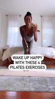 a woman sitting on top of a bed next to a white wall with the words wake up happy with these 4 pilates exercises