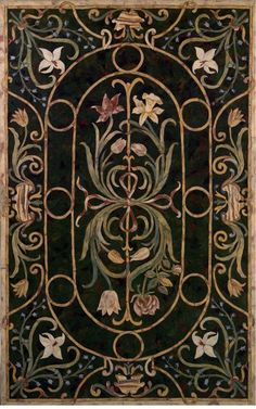 an art nouveau design with flowers and vines