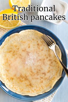 a pancake on a plate with a fork next to it and the words traditional british pancakes
