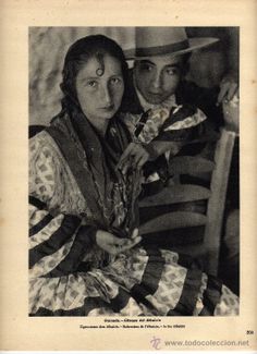 an old black and white photo of two people