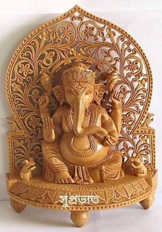 an elephant statue sitting on top of a wooden stand with the words omg india world written