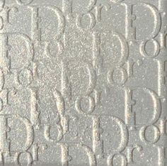 an image of a textured surface with numbers and letters in white on grey background