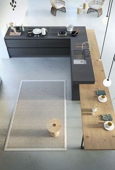 an overhead view of a modern kitchen and dining area