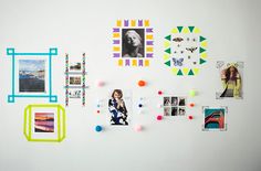 a white wall covered in pictures and magnets