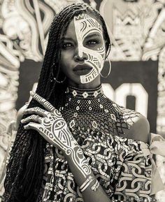 an image of a woman with face paint on her face and the caption below