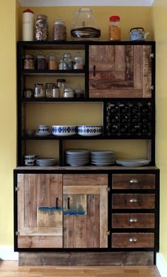 a wooden cabinet filled with lots of dishes
