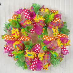 a brightly colored wreath with polka dots and bows