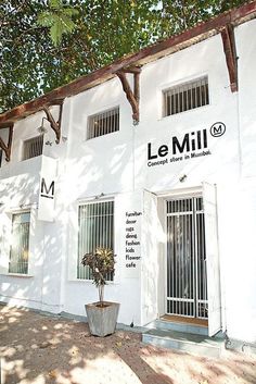 a white building with the name le mill on it's front door and windows