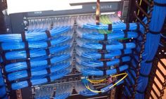 the inside of a server with many blue wires