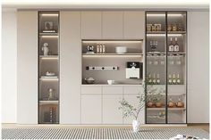 a kitchen with white cabinets and glass shelves