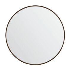 a round mirror with brown trim around it