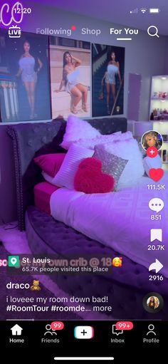 the room is decorated in purple and has pictures hanging on the wall above the bed