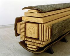a stack of wooden pieces sitting on top of a hard wood floor