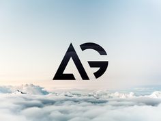 an aerial view of clouds and mountains with the letter g above them
