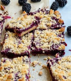 blueberry crumb bars cut into squares on a table