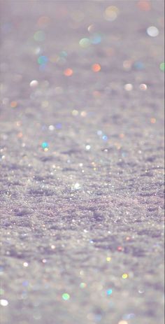a blurry photo of some water droplets on the ground