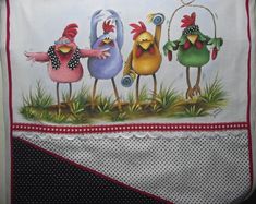 three roosters are hanging on the side of a kitchen towel with polka dot trim