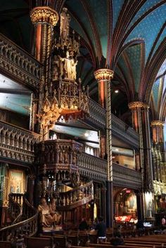 the inside of a church with many chandeliers