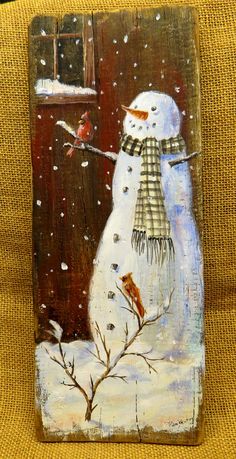 a painting of a snowman with a bird on it