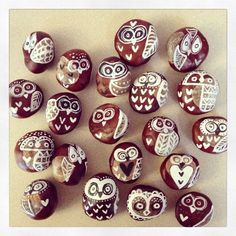 a group of painted rocks with owls and hearts on them