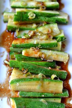cucumbers with sauce on a white plate