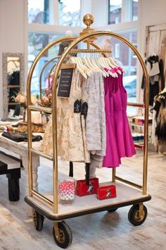 This bellmans hotel luggage cart used as a clothing rack is one of the whimsical touches to Number Fourteen Boutique in Lawrenceville. Store Displays, Retail Merchandising, Boutique Owner, Boutique Shop