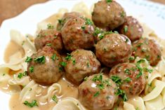 some meatballs and noodles on a white plate