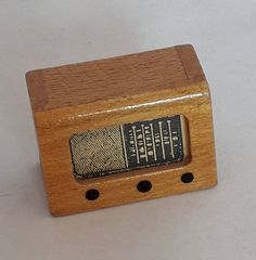 a small wooden radio sitting on top of a table