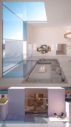 the interior of a modern living room with white walls and floor to ceiling glass windows