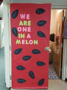 we are one in a melon bulletin board on the front door to an office