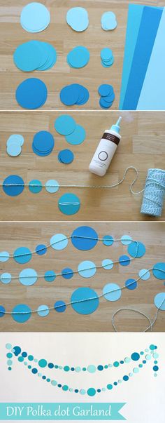 blue polka dot garland is hanging on the floor with tape and scissors next to it