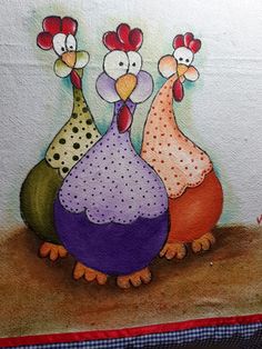 three colorful chickens are standing next to each other
