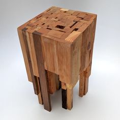 a wooden stool made out of pieces of wood