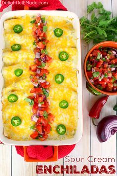 The only enchilada recipe you'll ever need! Stuffed with seasoned ground beef and cheese, smothered with a thick, delicious sour cream sauce, topped with more cheese and baked to perfection, these enchiladas are incredible! Amazing with pico de gallo and all your favorite Tex-Mex fixings! Sour Cream Enchiladas, Enchilada Recipes, Shredded Chicken Enchiladas, Mexican Dishes, Mexican Lasagna