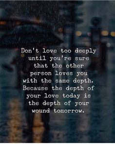 a person walking down the street in the rain with an umbrella over their head and text that reads, don't love too deep until you're sure that other person
