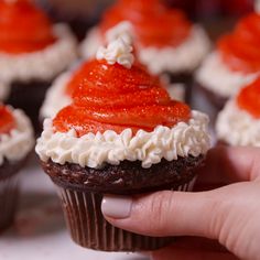 These Santa cupcakes are almost too cute to eat. Almost. Get the recipe at Delish.com. #delish #easy #recipe #santa #cupcakes #santahat #dessert #cake #chocolate #frosting #christmas #christmasrecipes #ideas Tiramisu, Diy, Natal, Christmas Cupcakes