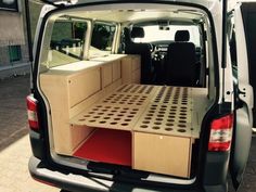 the back end of a van with drawers in it