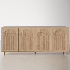 the sideboard is made out of wood and has an arched design on it's sides