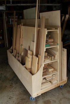 a wooden cart filled with lots of wood