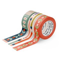 a roll of washi tape with flowers and leaves on the side, in various colors