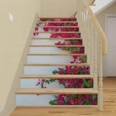 the stairs are decorated with pink flowers