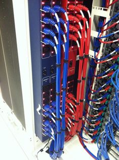 the inside of a server with many cables and wires attached to it's sides