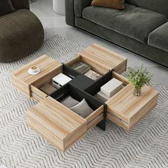 a living room with a couch, coffee table and two planters on the floor