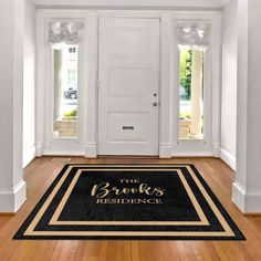 a black and gold door mat that says the brooks residence on it in front of two white doors