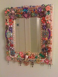 a mirror that has some beads on it