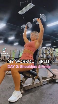 a woman is sitting on a bench with dumbbells in front of her and the words, my workout split day 2 shoulders & arms